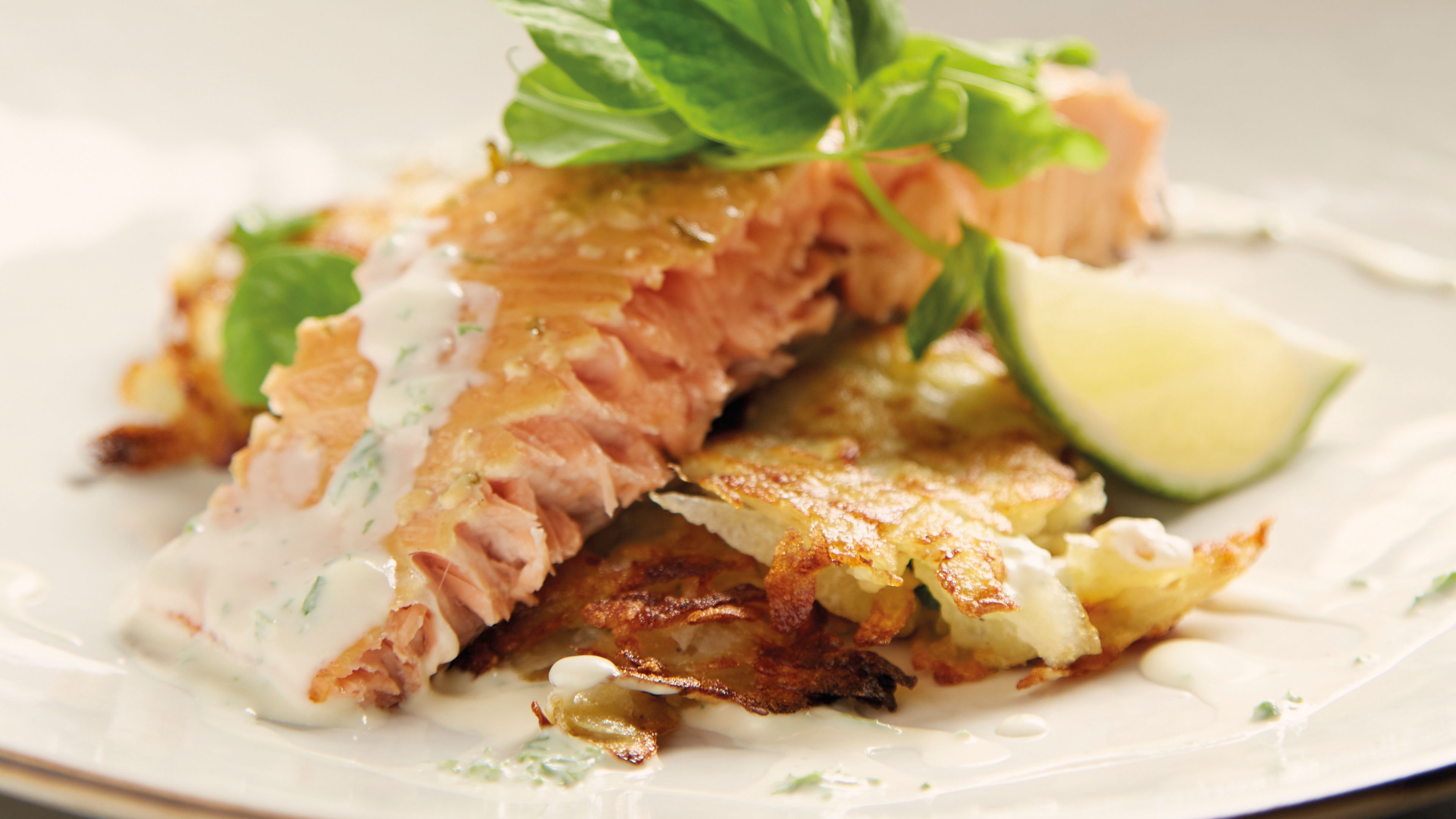  Hot smoked salmon with potato rosti and herbed cream fraiche 


